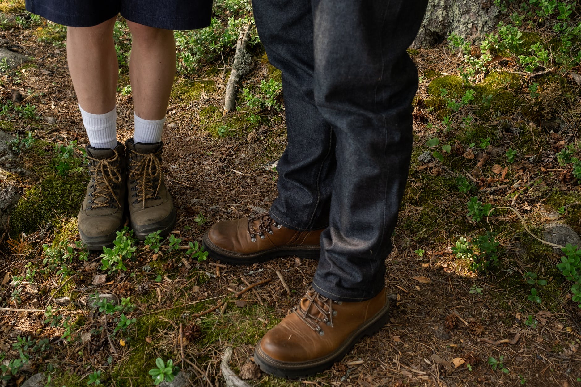footwear worn by man and boy while hiking in forest