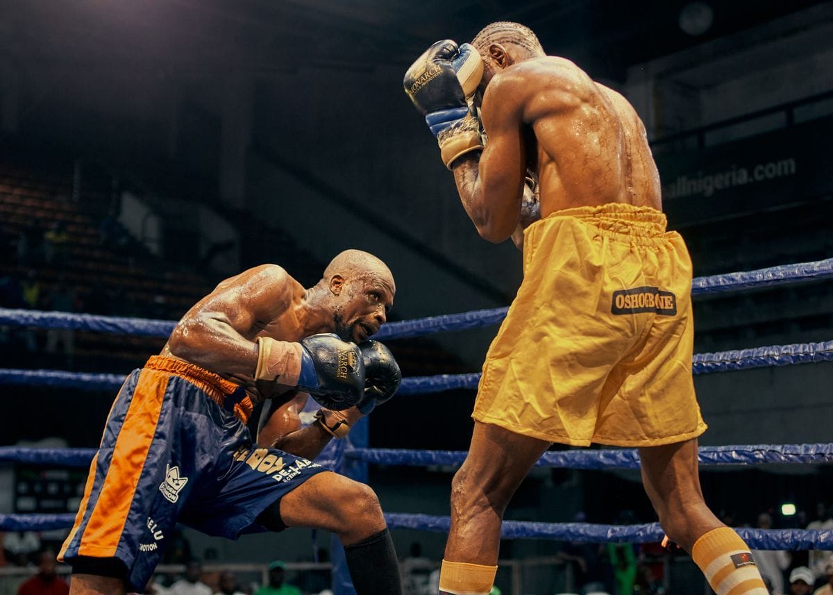 mma vs boxing fighters facing off in the ring