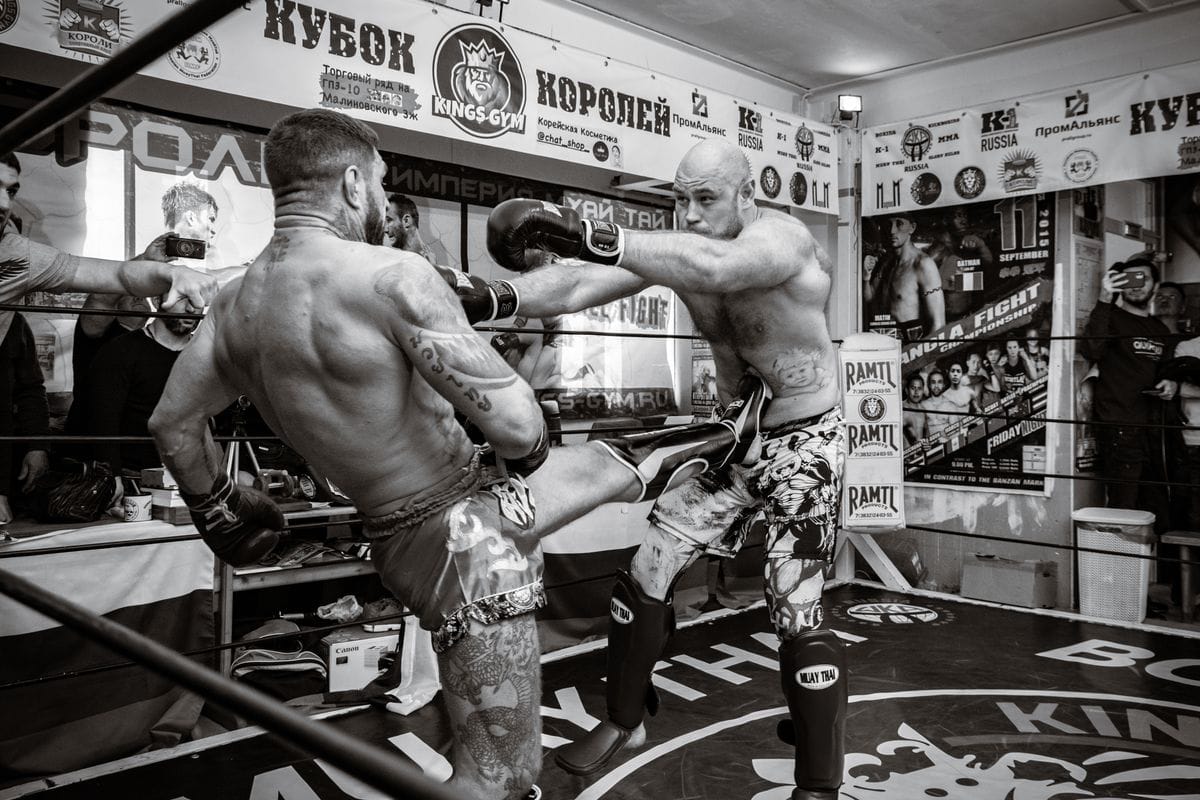 muay thai fighters competing in a boxing ring