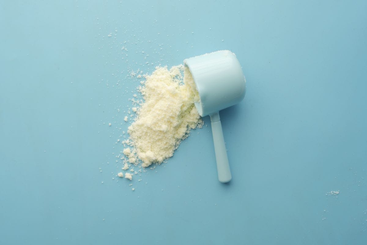 Whey protein powder and scoop close-up — protein whey Malaysia buying tips