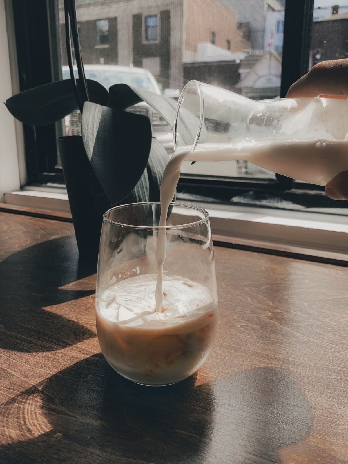 Fresh milk poured into a glass — protein milk numbers
