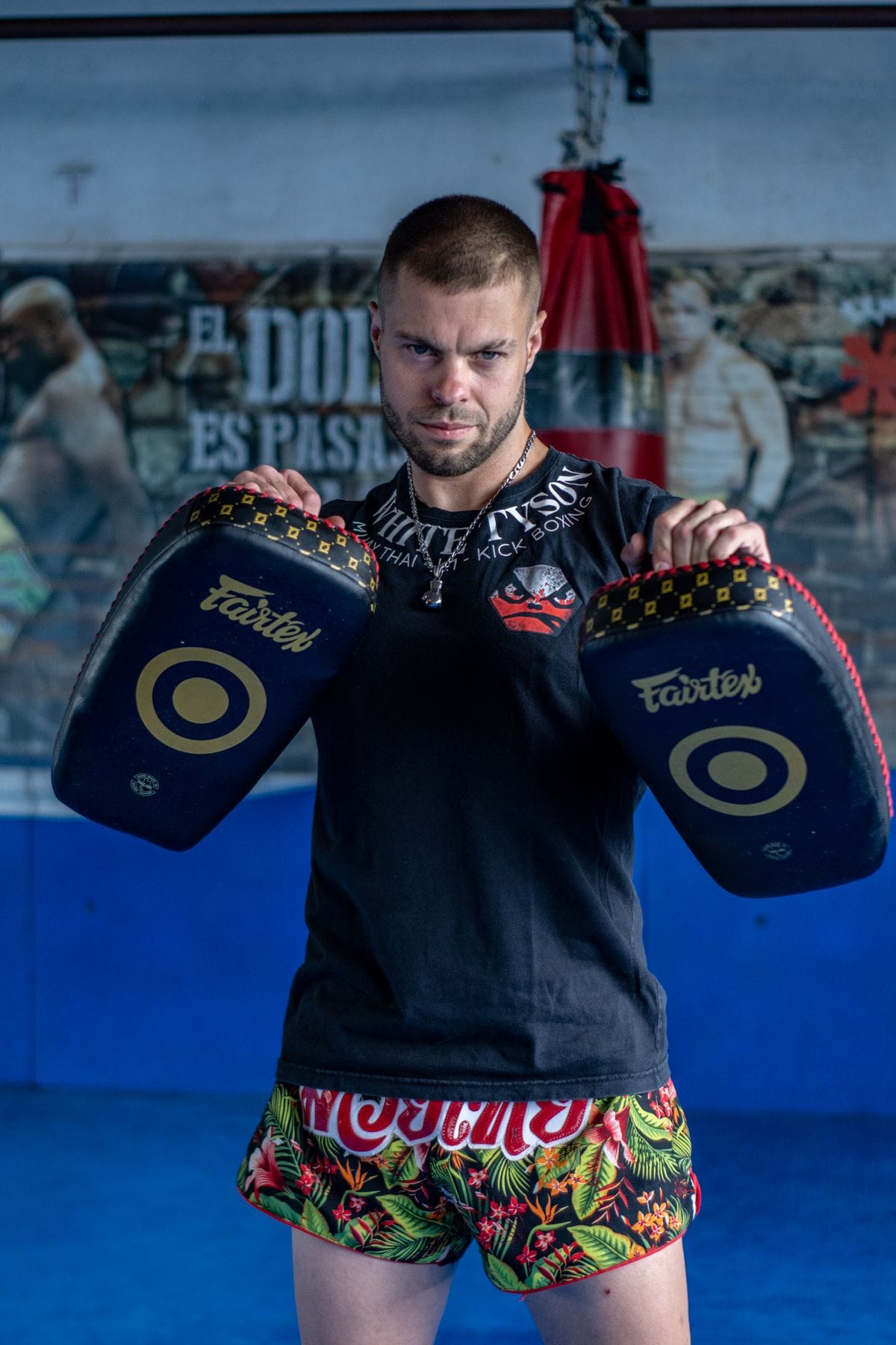 muay thai stance and kick pad practice in the gym