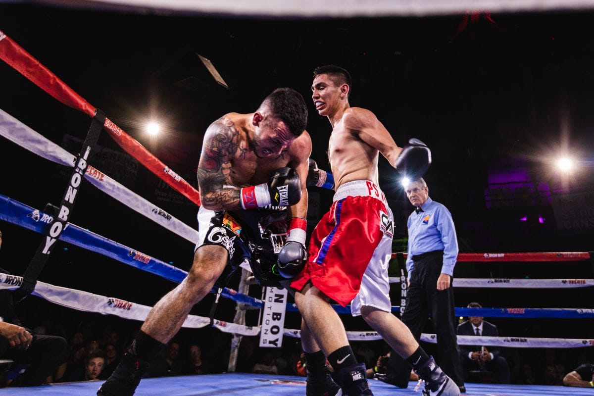 boxers exchanging punches in a ring