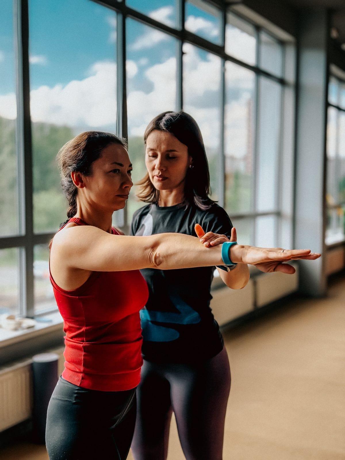 personal training gym session with a coach guiding one client