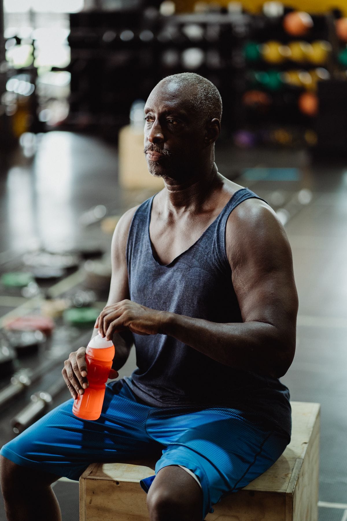 Man having a protein shake after training in the gym