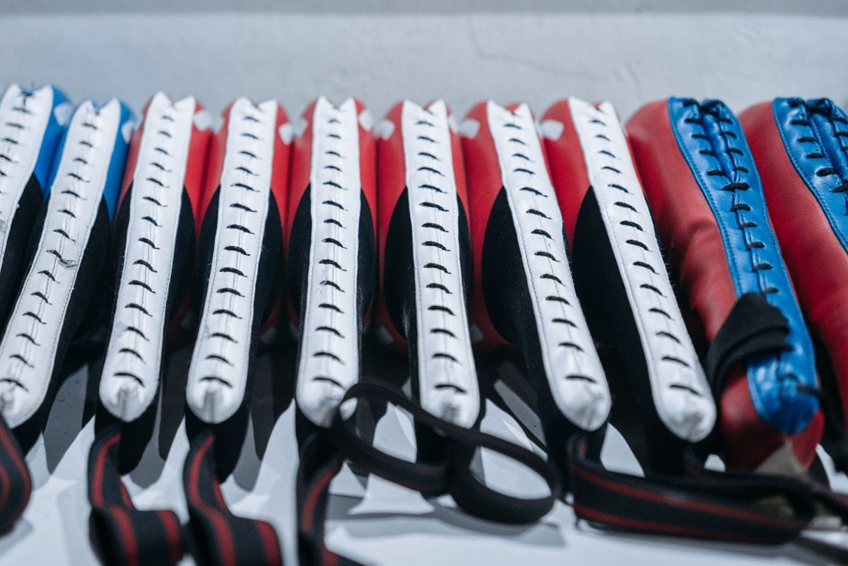 muay thai and boxing pads lined up for a training session