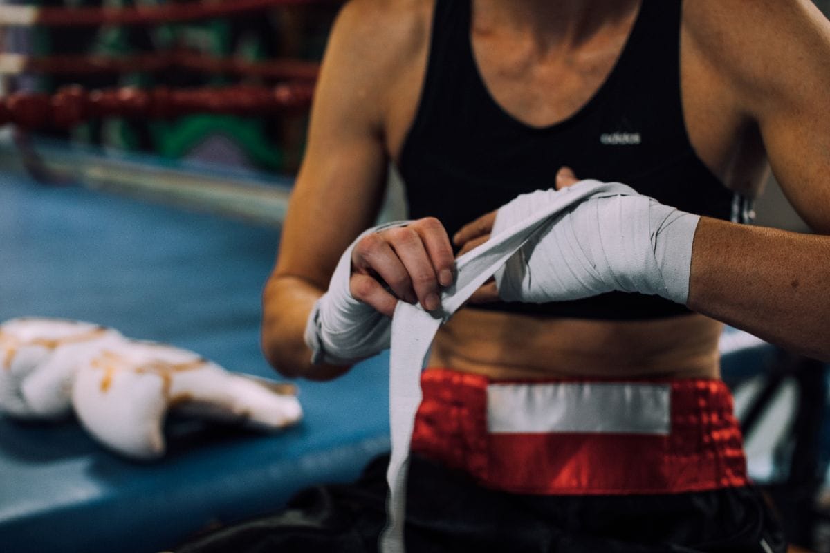 Wrapping hands before a thai boxing class